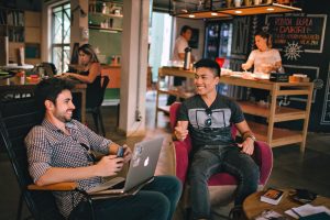 young adults interacting at workplace