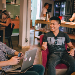 Millennials having conversation in the workplace